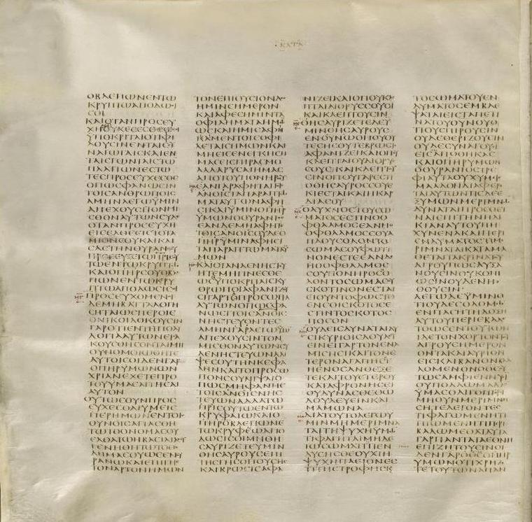 A parchment page laid out in four narrow columns of closely written Greek capital letters, with a few marks in the margins