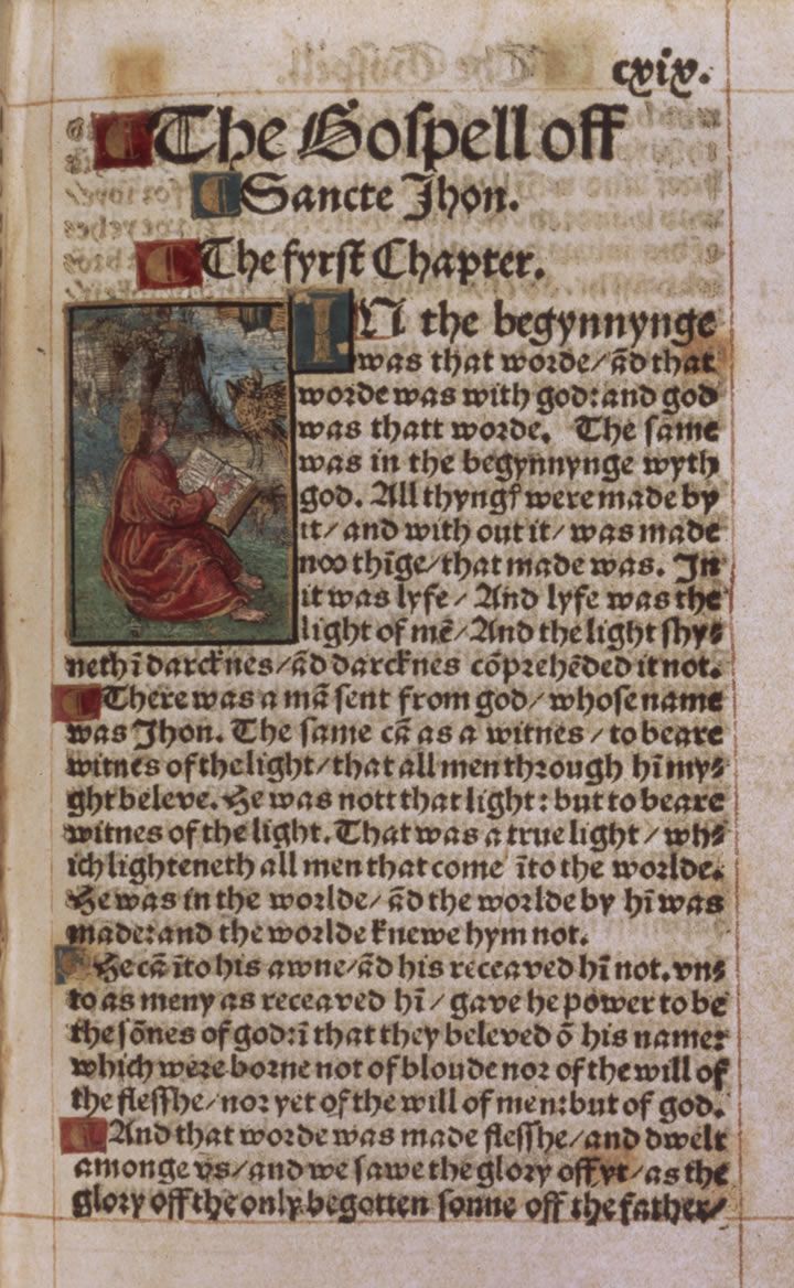 A printed page in black-letter type headed The Gospell off Sancte Jhon, The fyrst Chapter, with a small painted picture of a robed figure writing in a book beside the first lines, and red initial marks in the margin