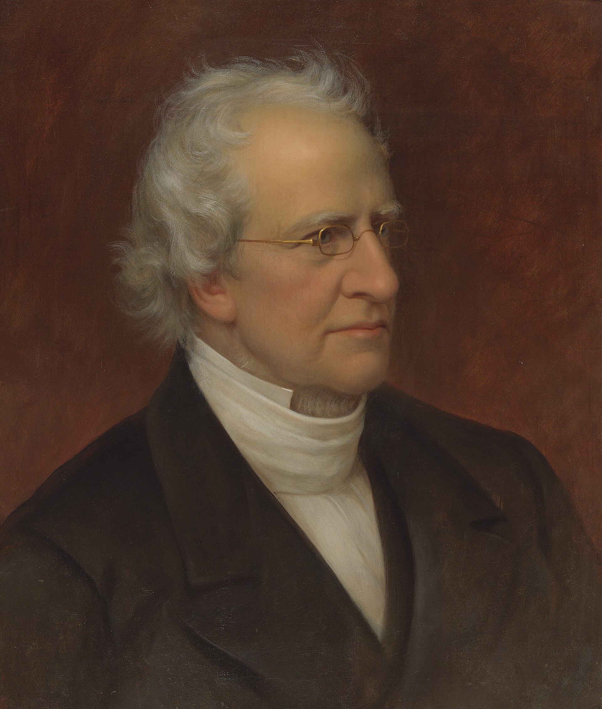 Oil portrait of a middle-aged man with dark hair, dark coat and high white collar, half length, against a plain dark background