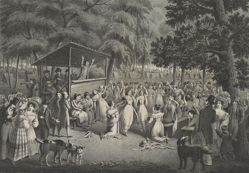 Lithograph of a nighttime outdoor religious meeting in a forest clearing, with a preacher on a raised wooden stand, a large crowd on benches, tents among the trees and people kneeling and raising their arms