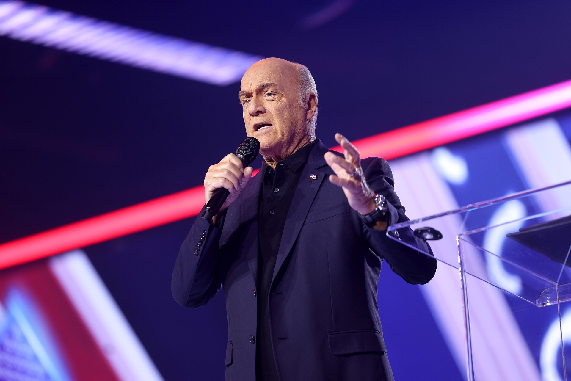 Greg Laurie speaking with attendees at a convention center event
