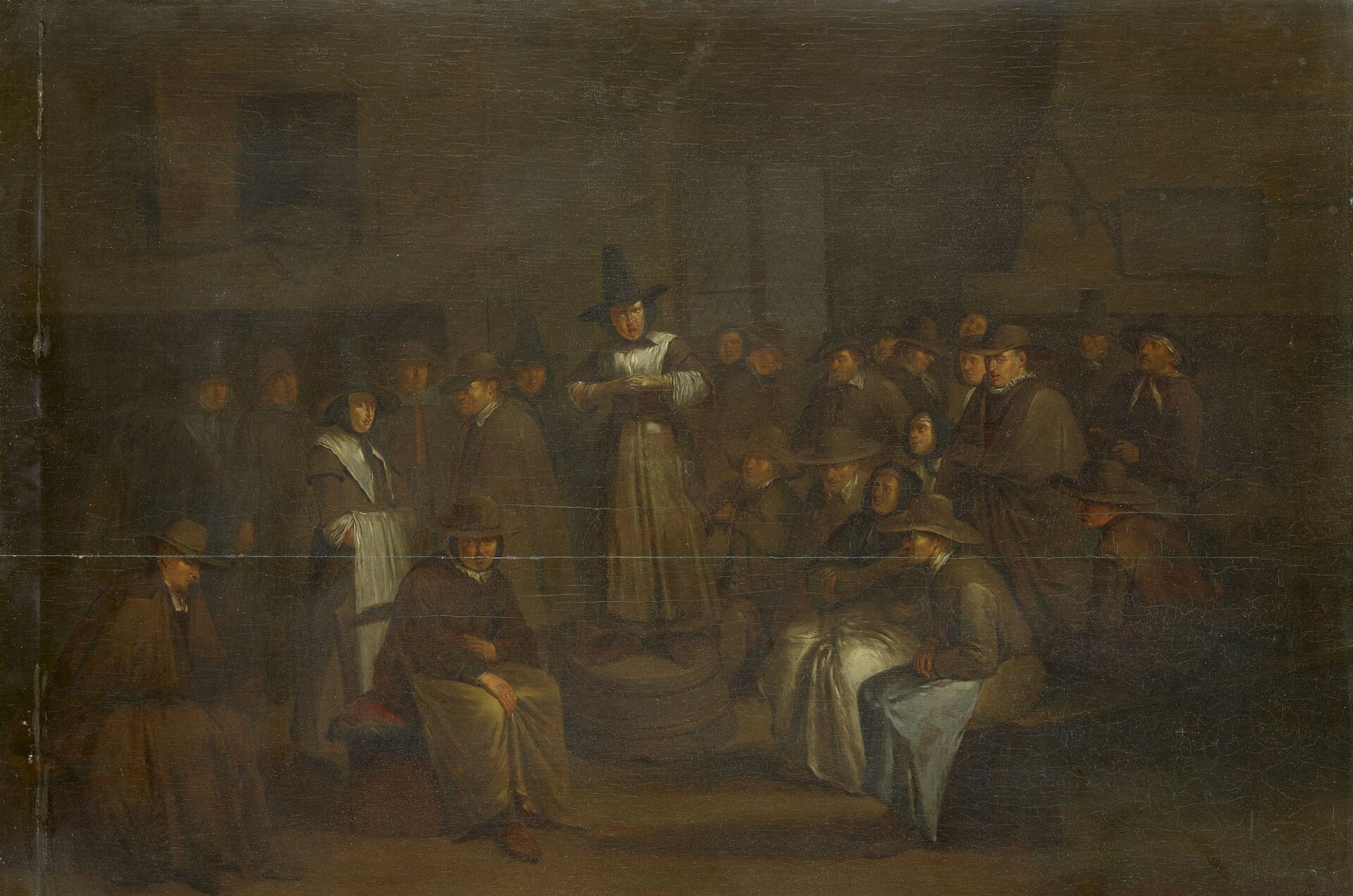 Painting of a crowded room with plainly dressed men in broad hats and women in white caps; a woman stands on a bench and speaks while others sit, stand or listen