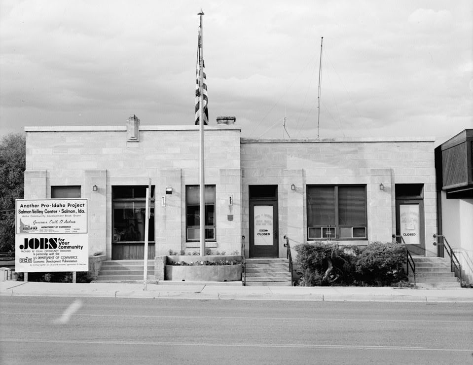 Two-story sandstone Art Deco city hall and library building on a street corner, Salmon, Idaho