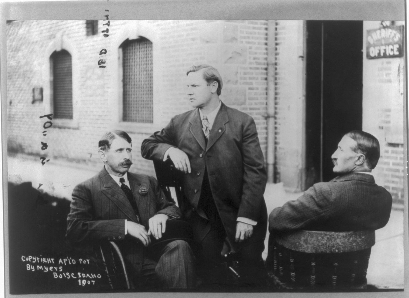 Bill Haywood, Charles Moyer and George Pettibone seated together, 1907