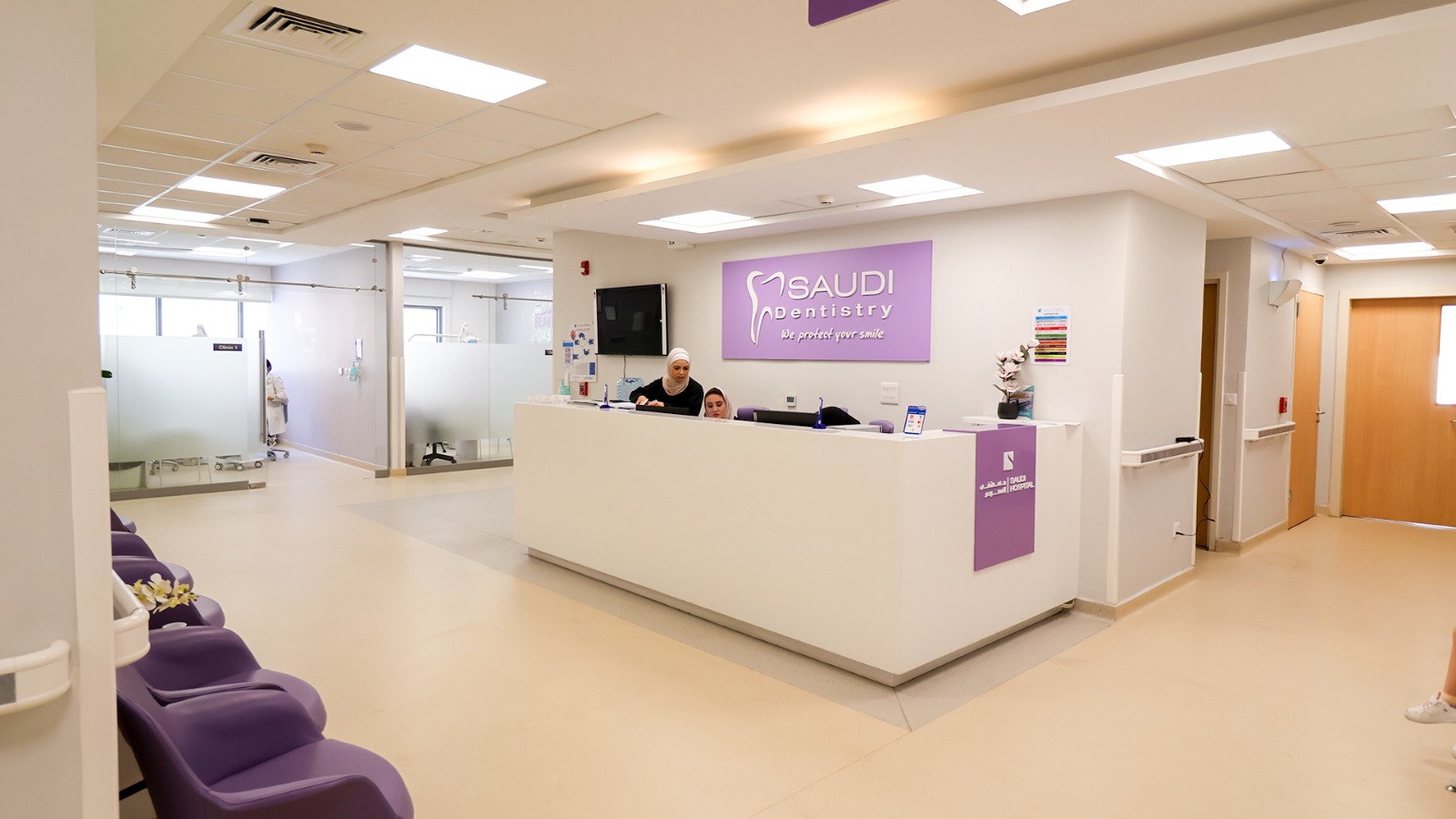 The reception desk and waiting area of a dental clinic
