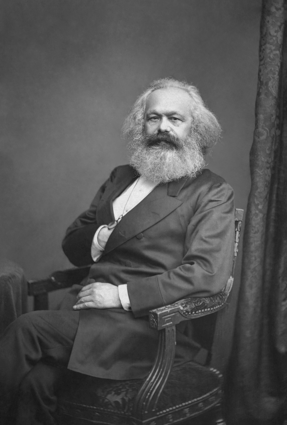 Photograph of Karl Marx in old age, with a full white beard and a high forehead