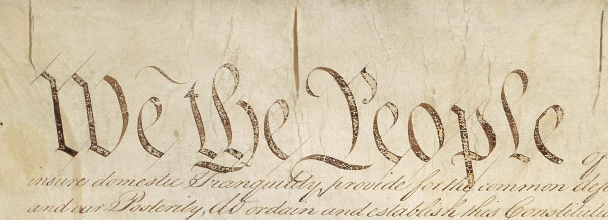 The first page of the engrossed Constitution, with the large words We the People in script