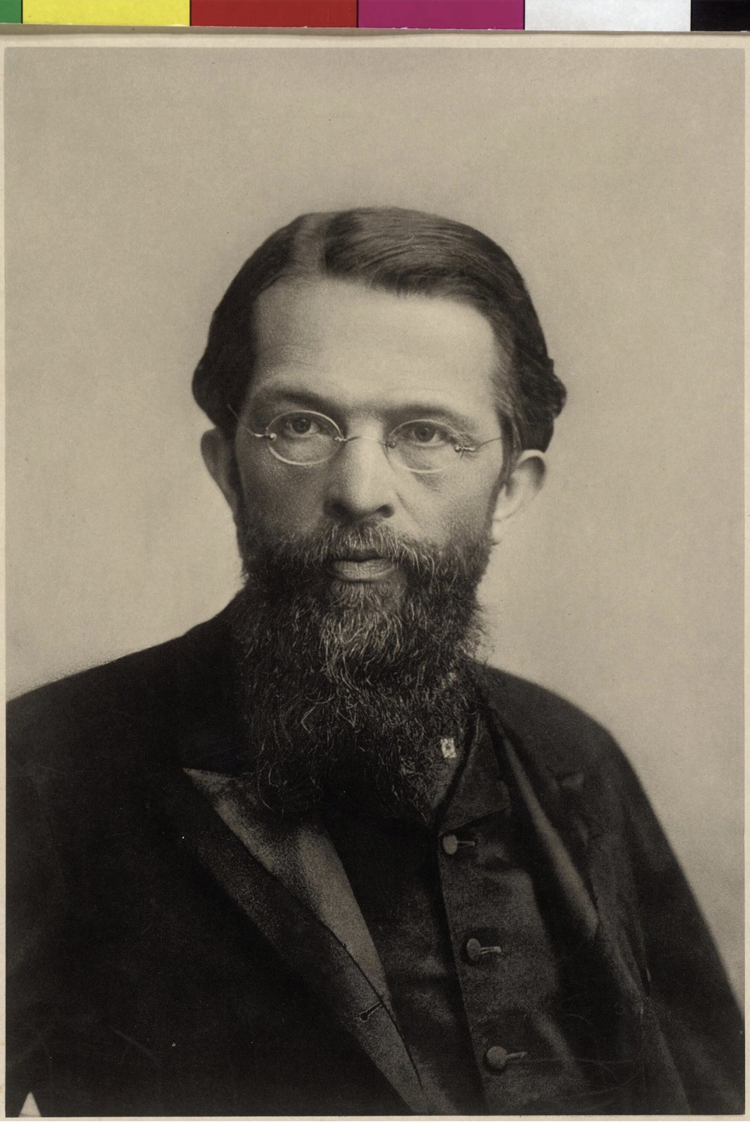 Photograph of Carl Menger, a bearded man in a dark suit, in three-quarter view