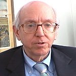 Portrait of Judge Richard Posner, a balding man in glasses and a dark suit