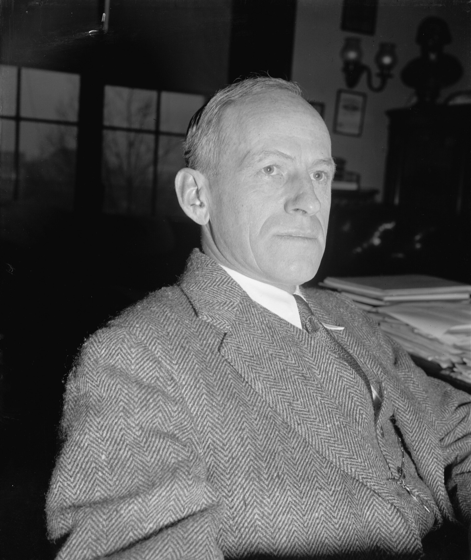 Black and white studio portrait of Senator Millard Tydings in a dark suit