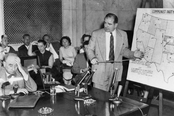 Two men seated at a hearing table during a Senate hearing