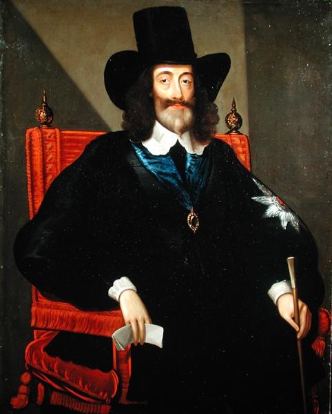 Painted portrait of King Charles I seated, wearing a tall black hat and dark cloak, at his trial in 1649